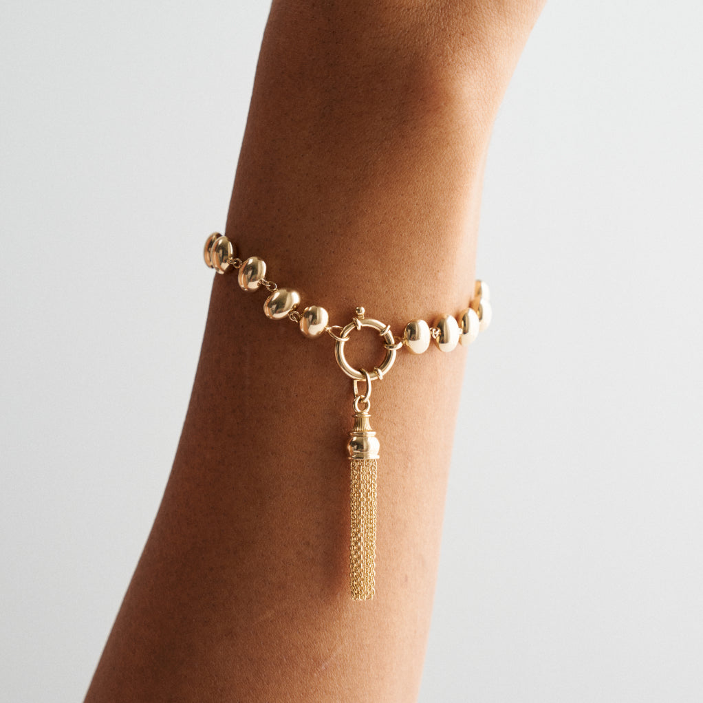 GOLDEN TASSEL CHARM