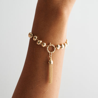 GOLDEN TASSEL CHARM